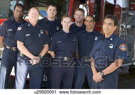 Six firefighters standing in front of fire engine with captain (depth of field) View Large Photo Image Stock Image - Six firefighters standing in front of fire engine with captain (depth of field). Fotosearch