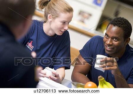 Three firefighters in break room drinking coffee and talking (selective focus) View Large Photo Image Stock Image - Three firefighters in break room drinking coffee and talking (selective focus). Fotosearch