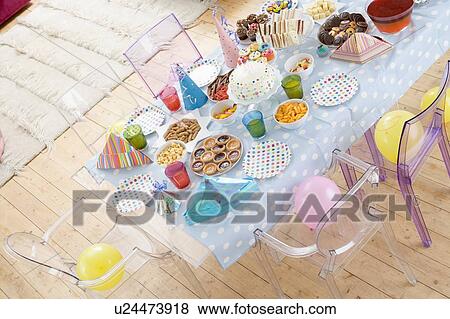 Birthday party table setting with food View Large Photo Image Stock Photo - Birthday party table setting with food. Fotosearch