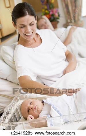 Pregnant mother with baby in hospital smiling View Large Photo Image Stock Photography - Pregnant mother with baby in hospital smiling. Fotosearch