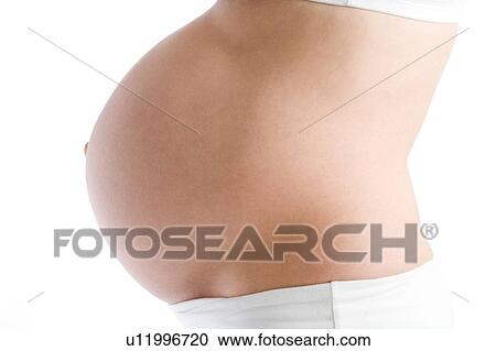 Pregnant woman's exposed belly View Large Photo Image Stock Image - Pregnant woman's exposed belly. Fotosearch