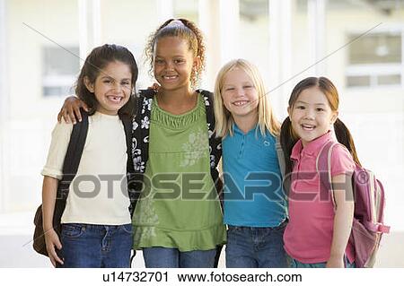Four students outside school standing together smiling (high key) View Large Photo Image Stock Image - Four students outside school standing together smiling (high key). Fotosearch