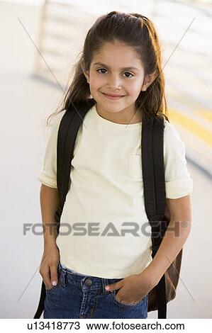 Student standing outdoors smiling (high key) View Large Photo Image Stock Image - Student standing outdoors smiling (high key). Fotosearch