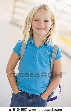 Student standing outdoors smiling (high key) View Large Photo Image Stock Photo - Student standing outdoors smiling (high key). Fotosearch
