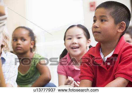 Students in class sitting on floor (selective focus) View Large Photo Image Stock Photo - Students in class sitting on floor (selective focus). Fotosearch