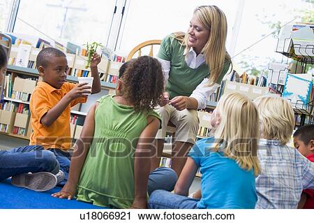 Teacher in class showing students bamboo plant View Large Photo Image Stock Image - Teacher in class showing students bamboo plant. Fotosearch