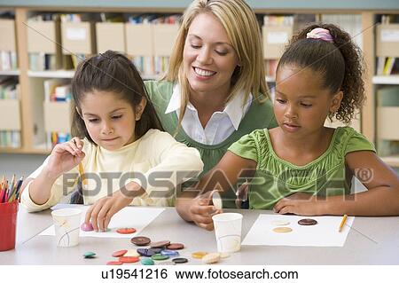 Two students in art class with teacher View Large Photo Image Stock Photograph - Two students in art class with teacher. Fotosearch
