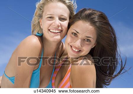 Stock Photography - Two young women posing outdoors. Fotosearch