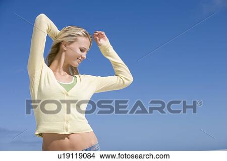 Young woman posing outdoors View Large Photo Image Picture - Young woman posing outdoors. Fotosearch