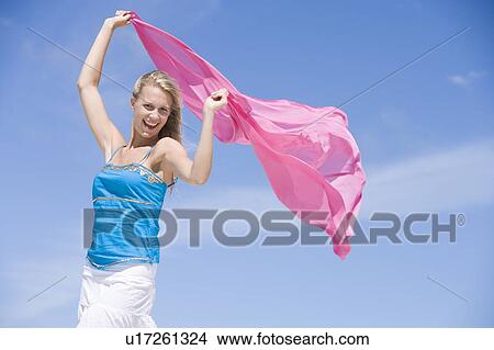 Picture - Young woman posing with a scarf. Fotosearch