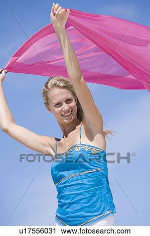 Young woman posing with a scarf View Large Photo Image Stock Image - Young woman posing with a scarf. Fotosearch