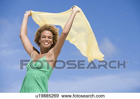 Young woman posing with a scarf View Large Photo Image Stock Photo - Young woman posing with a scarf. Fotosearch