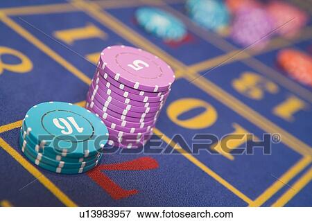 Stock Photo - Chips on a roulette table (selective focus/close up). Fotosearch