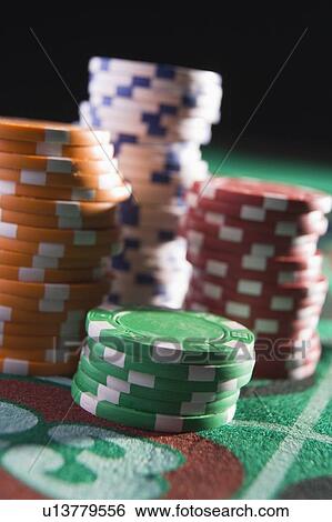 Chips piled on a roulette table (close up/depth of field) View Large Photo Image Stock Photograph - Chips piled on a roulette table (close up/depth of field). Fotosearch