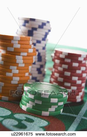 Chips piled on a roulette table (close up/depth of field) View Large Photo Image Stock Photography - Chips piled on a roulette table (close up/depth of field). Fotosearch