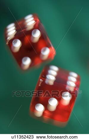 Dice rolling on a poker table (close up/blur) View Large Photo Image Stock Image - Dice rolling on a poker table (close up/blur). Fotosearch
