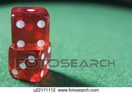 Dice sitting on a poker table (close up/selective focus) View Large Photo Image Stock Image - Dice sitting on a poker table (close up/selective focus). Fotosearch