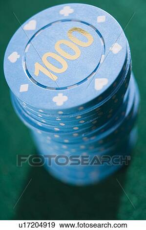 Poker chips piled on a poker table (close up/depth of field) View Large Photo Image Stock Photo - Poker chips piled on a poker table (close up/depth of field). Fotosearch