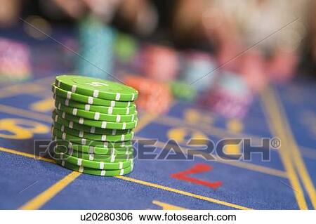 Stock Photograph - Roulette table with chips on it (selective focus). Fotosearch
