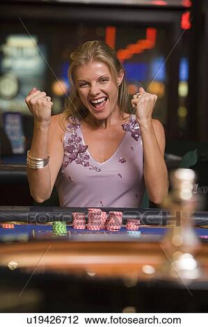 Woman in casino winning roulette smiling (selective focus) View Large Photo Image Stock Image - Woman in casino winning roulette smiling (selective focus). Fotosearch