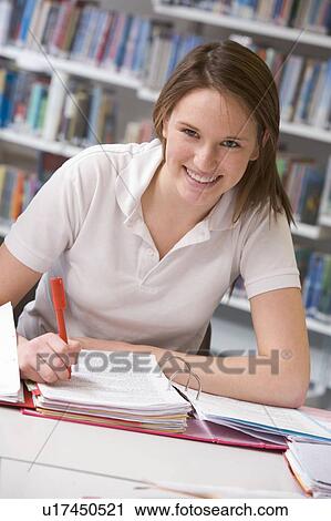Student writing and studying View Large Photo Image Stock Image - Student writing and studying. Fotosearch