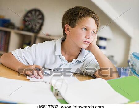 Young Boy Doing Homework In His Room View Large Photo Image Stock Image - Young Boy Doing Homework In His Room. Fotosearch