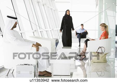 Airline passengers waiting in departure gate View Large Photo Image Stock Image - Airline passengers waiting in departure gate. Fotosearch