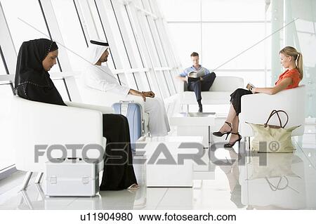 Airline passengers waiting in departure gate View Large Photo Image Stock Image - Airline passengers waiting in departure gate. Fotosearch