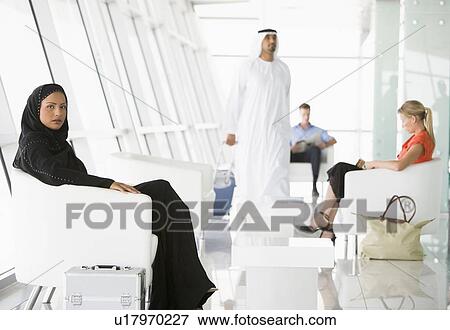 Airline passengers waiting in departure gate View Large Photo Image Stock Photo - Airline passengers waiting in departure gate. Fotosearch