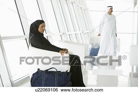Airline passengers waiting in departure gate View Large Photo Image Stock Photograph - Airline passengers waiting in departure gate. Fotosearch
