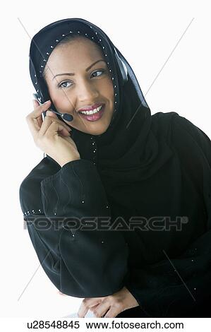 Woman indoors wearing headset and smiling (high key/selective focus) View Large Photo Image Stock Photography - Woman indoors wearing headset and smiling (high key/selective focus). Fotosearch
