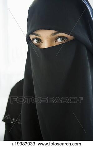 Woman wearing black veil indoors (high key) View Large Photo Image Stock Image - Woman wearing black veil indoors (high key). Fotosearch