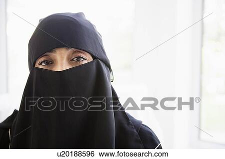 Woman wearing black veil indoors (high key) View Large Photo Image Stock Photograph - Woman wearing black veil indoors (high key). Fotosearch