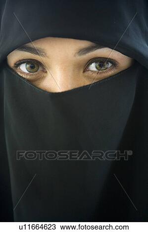 Stock Image - Woman wearing black veil indoors. Fotosearch