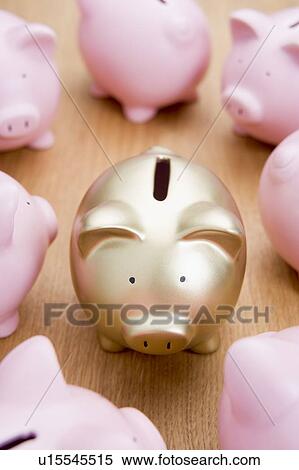 Stock Photography - Golden Piggy Bank Among Many Pink Ones. Fotosearch
