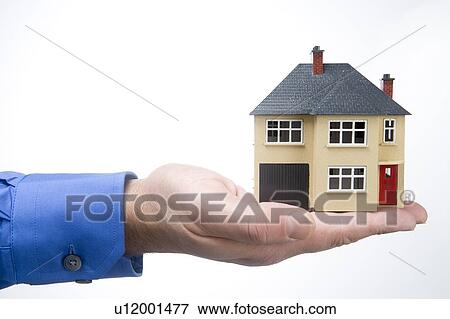 Stock Photo - Holding House. Fotosearch