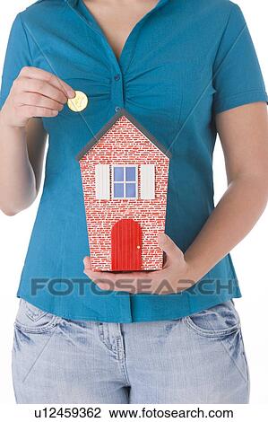 Stock Image - Saving For A House. Fotosearch