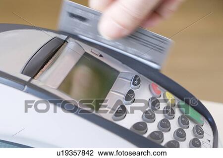 Stock Image - Swiping Credit Card. Fotosearch