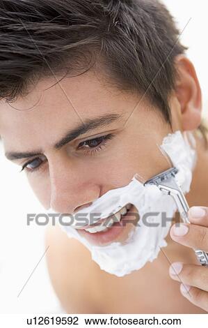 Man shaving and smiling View Large Photo Image Stock Image - Man shaving and smiling. Fotosearch