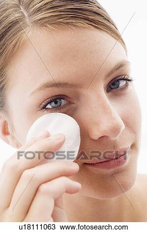 Woman removing makeup View Large Photo Image Stock Image - Woman removing makeup. Fotosearch
