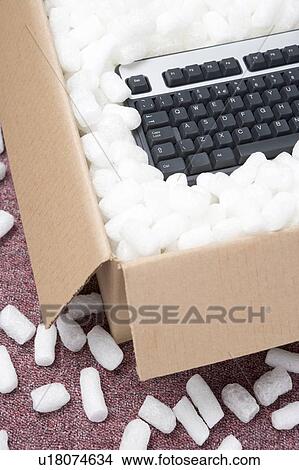 Picture - A Package Containing A Computer Keyboard. Fotosearch