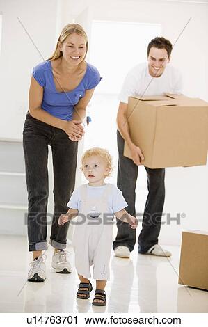 Family moving into new home smiling View Large Photo Image Stock Image - Family moving into new home smiling. Fotosearch