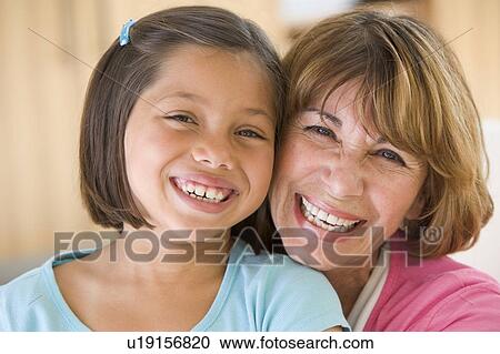 Grandmother and granddaughter smiling View Large Photo Image Stock Image - Grandmother and granddaughter smiling. Fotosearch