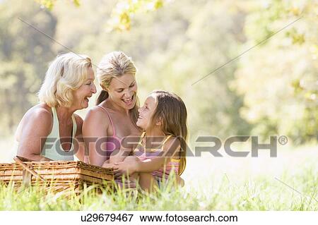 Grandmother with adult daughter and grandchild on picnic View Large Photo Image Stock Photo - Grandmother with adult daughter and grandchild on picnic. Fotosearch