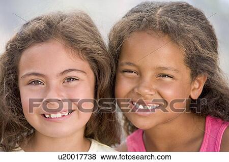 Stock Photo - Portrait Of Two Young Girls. Fotosearch