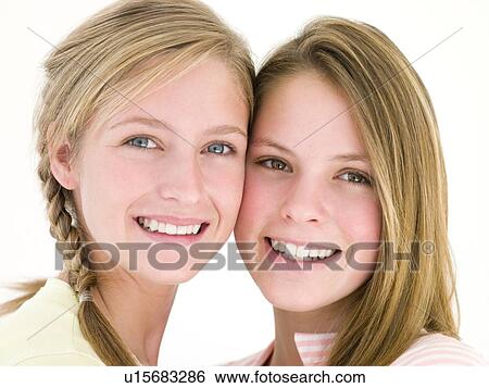 Stock Photograph - Two girl friends together smiling. Fotosearch