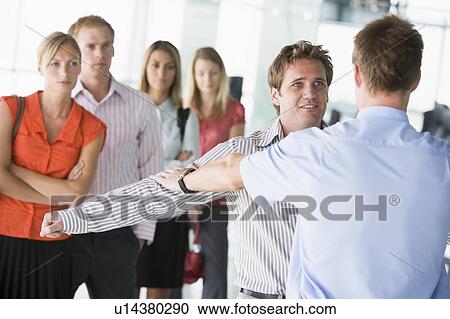 Stock Image - Airline passengers undergoing a security check. Fotosearch