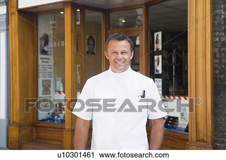 Barber standing outside shop. View Large Photo Image Stock Image - Barber standing outside shop.. Fotosearch