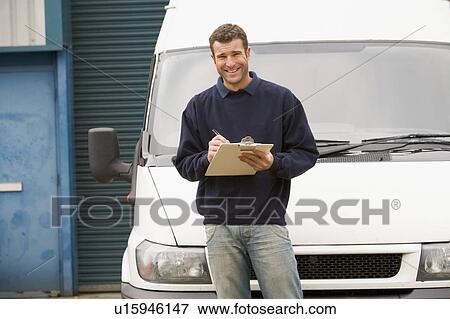 Deliveryperson standing with van writing in clipboard smiling View Large Photo Image Stock Photo - Deliveryperson standing with van writing in clipboard smiling. Fotosearch