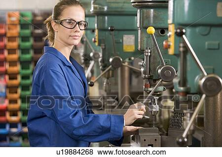 Machinist working on machine View Large Photo Image Stock Photo - Machinist working on machine. Fotosearch
